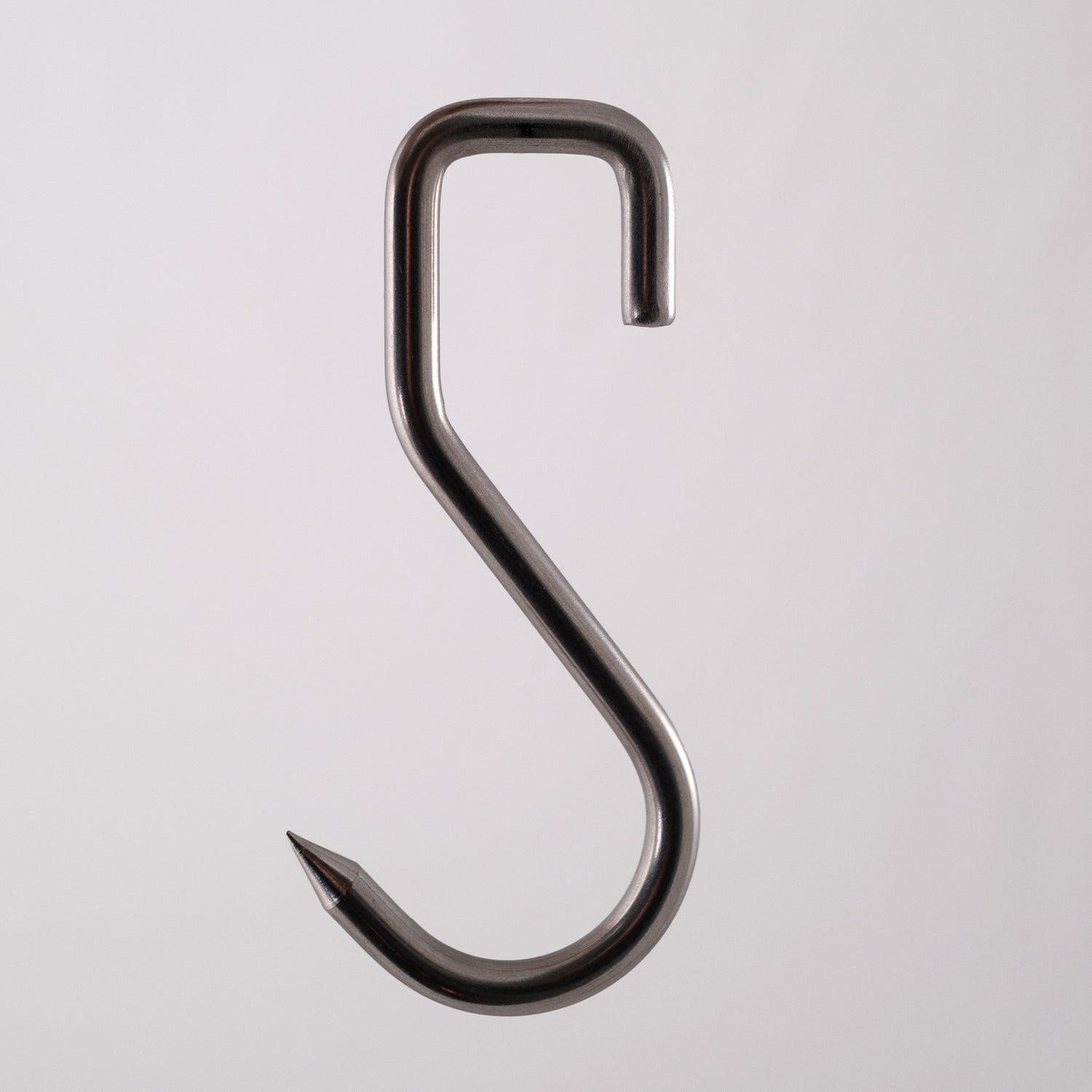 Food safe sharp stainless steel meat hook on a gray background