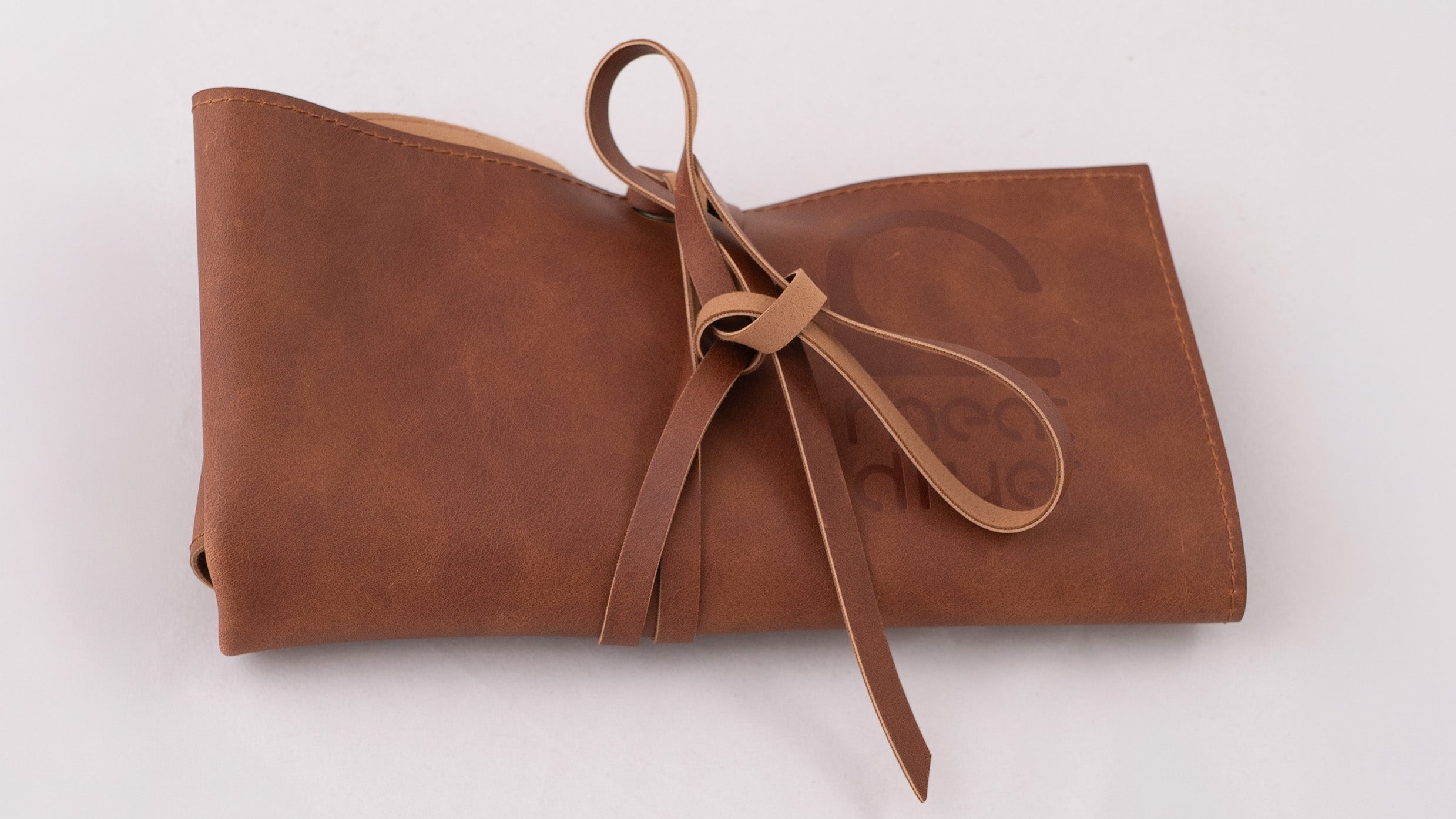Brown tool bag with a strap on a white background