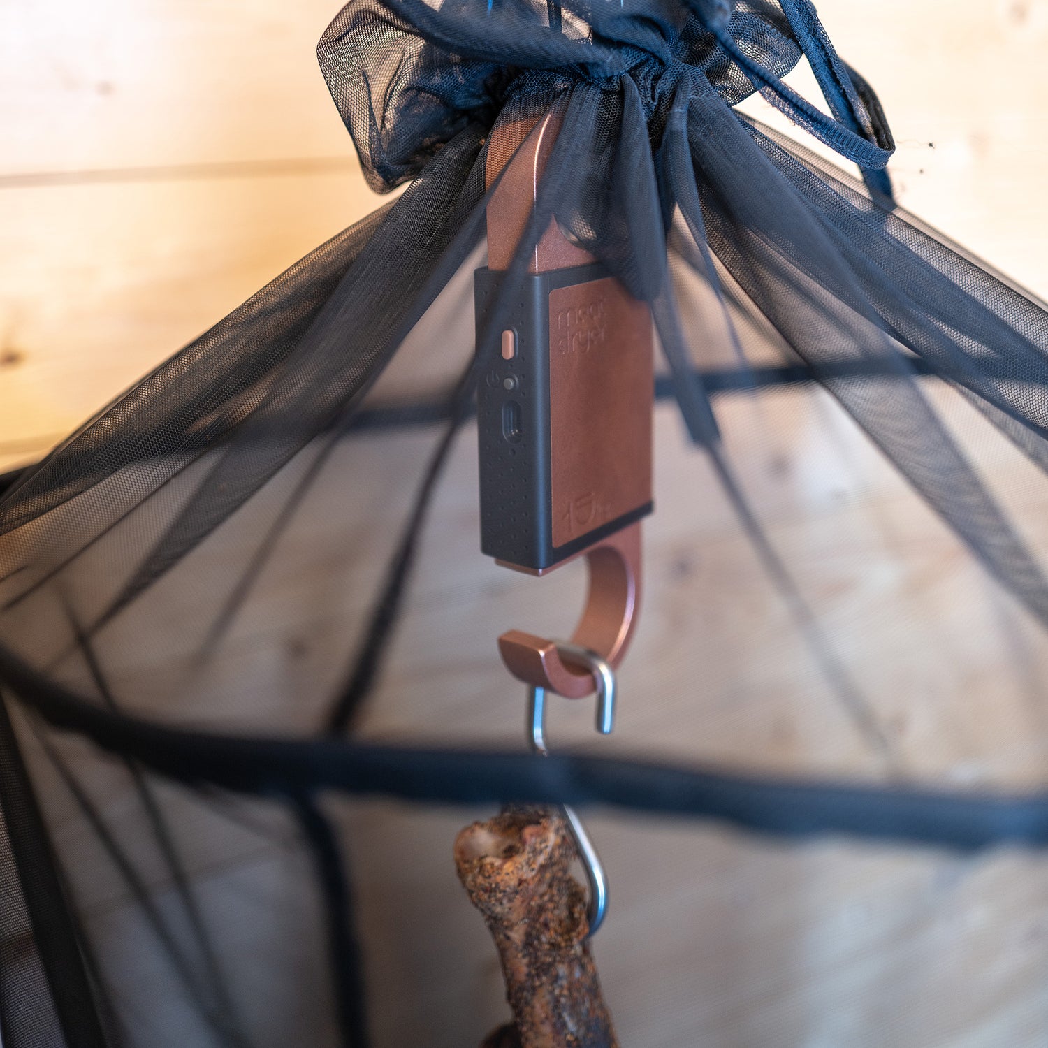 Close-up of a Meatdryer Artisan with meat hanging and a protective net against flies and insects