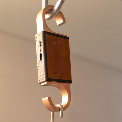 Smart meat hook with copper and brown design hanging in a metal carabiner